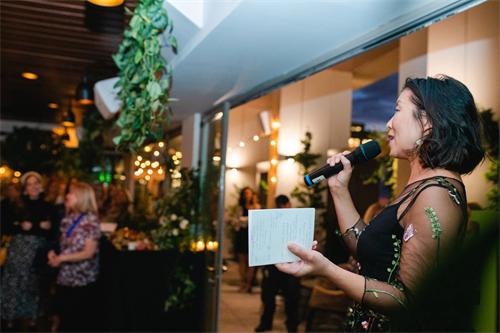 alt="Corporate event speech moment"